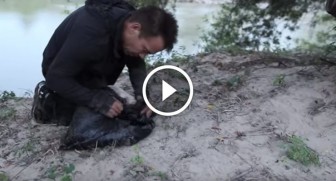 He comes across a moving garbage bag by a river. What he finds inside will break your heart