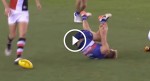 Australian football player breaks his own leg with his own foot attempting to kick the ball