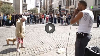 Old Lady Stops in Front of a Street Performer, But When She Looks Up? Everyone Is Stunned!